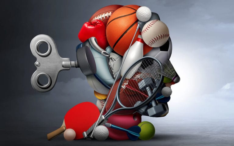 A number of sports equipment assembled to look like a human head.
